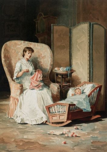 Mother sewing close to child in cradle